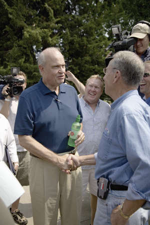 Former U.S. Senator and actor of Law & Order, Fred Thompson meeting U.S. Senator from Iowa, Republican Chuck Grassley, at Iowa State Fair to campaign for U.S. President, August 17, 2007, Des Moines, Iowaのeditorial素材