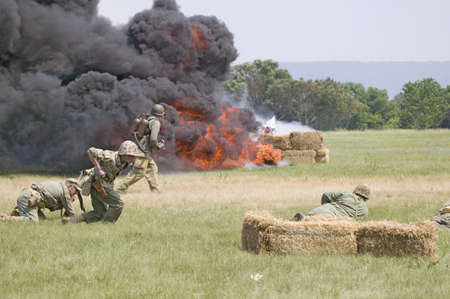 World War II reenactment of a battle between American infantryman and German soldiers, at Mid-Atlantic Air Museum World War II Weekend and Reenactment in Reading, PA held June 18, 2011のeditorial素材