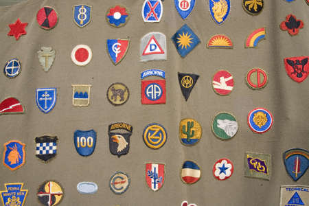 Detail of World War II army patches on side of tent at Mid-Atlantic Air Museum World War II Weekend...