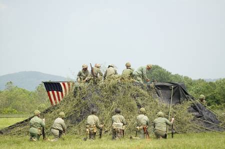 A World War II reenactment of US Marines raising the American flag on Iwo Jima on February 23, 1945 at Mid-Atlantic Air Museum World War II Weekend and Reenactment in Reading, PA held June 18, 2008のeditorial素材