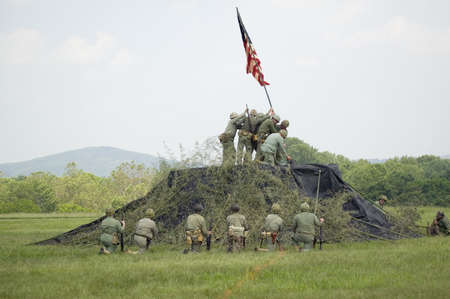 A World War II reenactment of US Marines raising the American flag on Iwo Jima on February 23, 1945...