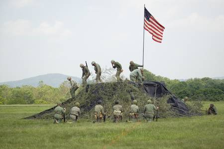 A World War II reenactment of US Marines raising the American flag on Iwo Jima on February 23, 1945 at Mid-Atlantic Air Museum World War II Weekend and Reenactment in Reading, PA held June 18, 2008のeditorial素材