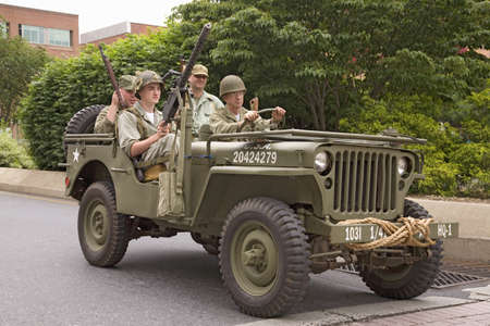 Reenactment of World War II Jeep and infantrymen driving in 1940s style parade in Reading, PA held June 18, 2008のeditorial素材