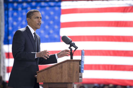 Presidential Candidate Barack Obama framed against American Flag at early vote for change Presidential rally, October 29, 2008 at Halifax Mall, Government Complex in Raleigh, NCのeditorial素材
