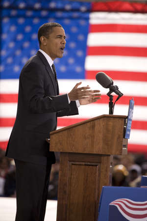Presidential Candidate Barack Obama framed against American Flag at early vote for change Presidential rally, October 29, 2008 at Halifax Mall, Government Complex in Raleigh, NCのeditorial素材