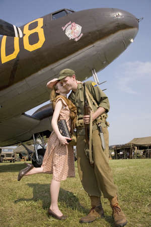 Reenactment of 1940s kiss of US soldier in front of World War II Bomber at Mid-Atlantic Air Museum...