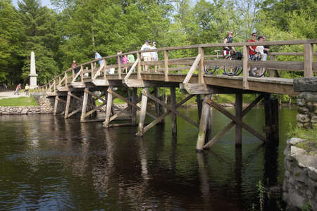 Tourists cross the Old North Bridge, Concert Mass, site of the first American victory in the Revolutionary War on April 19, 1775のeditorial素材