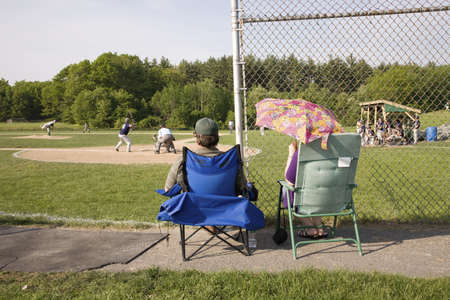 Parents watch Shrewsbury Colonials play Nashoba Chieftans high school baseball game, Shrewsbury, MA, 5/27/11のeditorial素材