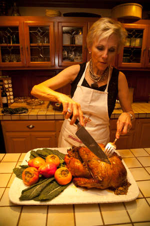 An elderly woman in the kitchen のeditorial素材