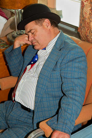 A man dressed up as Lou Costello taking a nap on Pearl Harbor Day World War II Troop Train, Los...