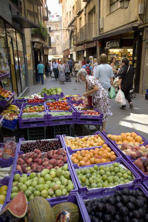 Woman shopping in central market of La Seu d'Urgell, (Sa Seu d'Urgell) in Catalunya, Spainのeditorial素材