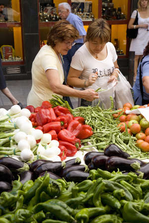 Women shopping for vegetables in Central Market of La Seu d'Urgell, (Sa Seu d'Urgell) in Catalunya, Spainのeditorial素材