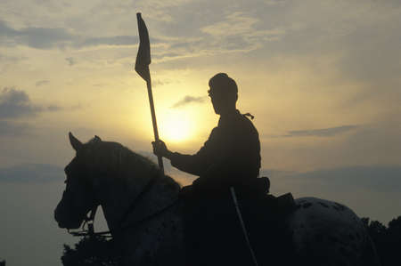 Silhouette of soldier on horseback with  gun during reenactment of Battle of Manassas marking the beginning of the Civil Warのeditorial素材