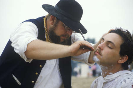 Confederate participants shaving in camp scene during recreation of Battle of Manassas, marking the beginning of the Civil Warのeditorial素材