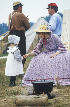 Young participants in Civil War costume in camp scene during reenactment of Battle of Manassas, Virginiaのeditorial素材