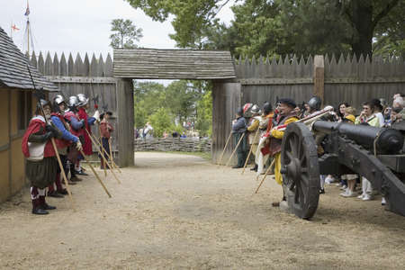 English reenactor soldiers standing at attention at front gate of James Fort, Jamestown Settlement, on 400th Anniversary of Jamestown, Virginia, May 4, 2007のeditorial素材