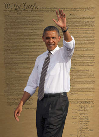President Barack Obama waving against a backdrop of the United States Constitution