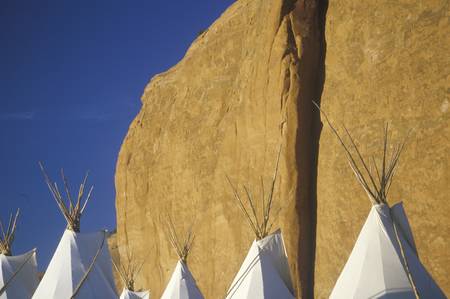 Navajo teepees against cliff, Gallup, NMのeditorial素材