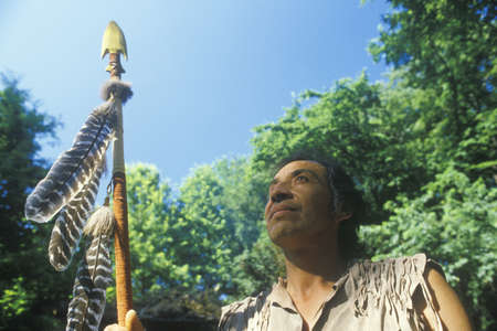 Native American Cherokee holding a spear, Tsalagi Village, Cherokee Nation, OKのeditorial素材
