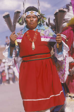 A Native American woman in traditional costume at the Corn Dance ceremony, Santa Clara Pueblo, NM