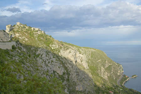 Looking up at Town of La Turbie with Trophee des Alpes and church, Franceのeditorial素材