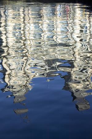 Morning water reflections of building at Port Vell, Old Harbor, Barcelona, Spainのeditorial素材
