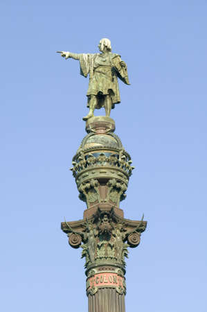 Statue of Christopher Columbus points west to New World, next to waterfront of Port Vell, Barcelona, Spainのeditorial素材