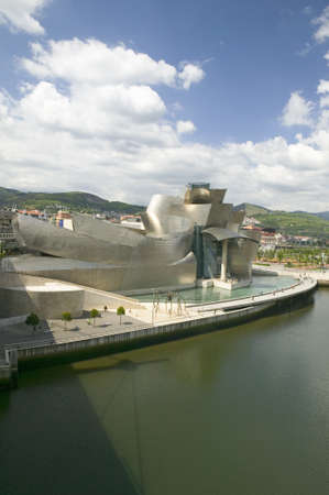 The Guggenheim Museum of Contemporary Art of Bilbao (Bilbo) on the river Ibaizabal, located on the North Coast of Spain in the Basque region. Nicknamed "The Hole", this is a contemporary museum built of titanium, limestone and glass and was designed by Caのeditorial素材