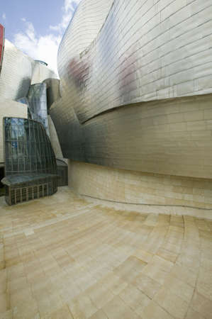Front entrance of the Guggenheim Museum of Contemporary Art of Bilbao (Bilbo), located on the North Coast of Spain in the Basque region. Nicknamed "The Hole", this is a contemporary museum built of titanium, limestone and glass and was designed by Canadiaのeditorial素材