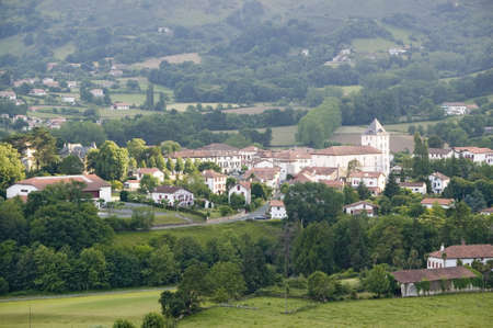 Farm fields in front of Sare, France in Basque Country on Spanish-French border, a hilltop 17th century village in the Labourd province. It is centered around the Place du Fronto, close to St. Jean de Luz, on the Cote Basque, France.のeditorial素材