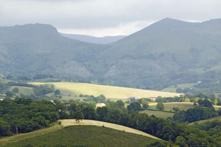 Sun and rays of light over Sare, France in Basque Country on Spanish-French border, is a hilltop 17th century village surrounded by farm fields, in the Labourd province, in the shadow of Mount Rhune, close to St. Jean de Luz, on the Cote Basque, France.のeditorial素材