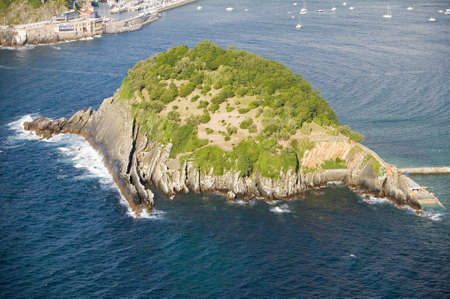 Isla Santa Clara Island in Bahia de La Concha, Donostia-San Sebastian, Basque region of Spain, the Queen of Euskadi's and Cantabrian Coast, as seen from Monte Igueldo overlook view spotのeditorial素材