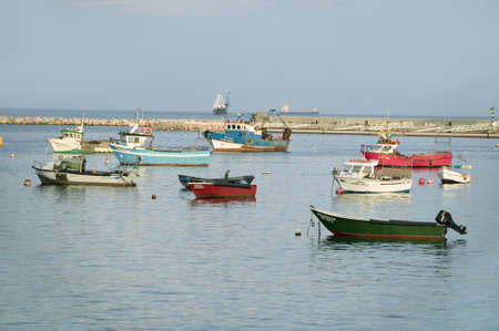Colorful boats at sunset in Cascais, the popular seaport north of Lisbon/Lisboa Portugalのeditorial素材
