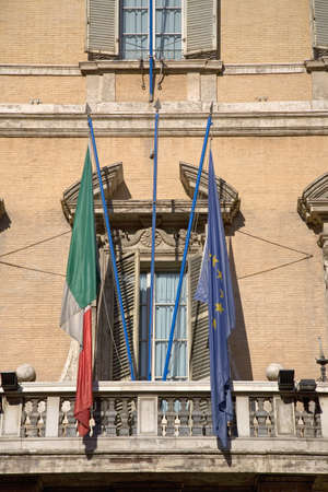 Italian and European Flag hanging from antique building in Rome, Italy, Europeのeditorial素材