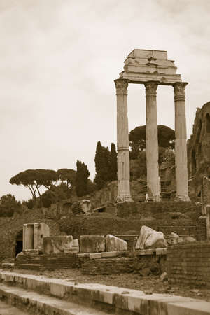 Sepia image of Temple of Castor & Pollux at Roman Forum seen from the Capitol, ancient Roman ruins, Rome, Italy, Europeのeditorial素材
