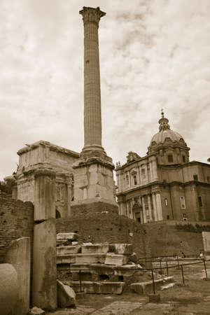 Sepia image of Column of Phocas at Roman Forum seen from the Capitol, ancient Roman ruins, Rome, Italy, Europeのeditorial素材