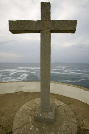 Cross overlooks Atlantic Ocean at Cruz do Remedios, near Peniche, west coast of Portugalのeditorial素材