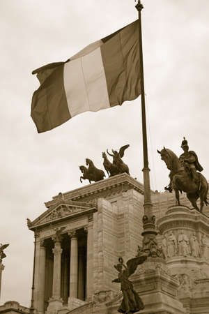 Sepia image of Italian flag flying over the Monument to King Victor Emmanuel II, Rome, Italy, Europe