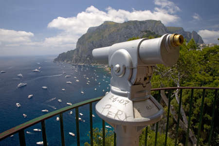 Telescope viewer of City of Capri, an Italian island off the Sorrentine Peninsula on the south side of Gulf of Naples, in the region of Campania, Province of Naples, Italy, Europeのeditorial素材