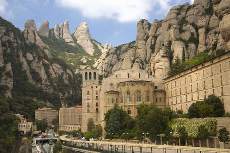The jagged mountains in Catalonia, Spain, showing the Benedictine Abbey at Montserrat, Santa Maria de Montserrat, near Barcelona, where some feel the Holy Grail had beenのeditorial素材