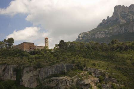 The jagged mountains in Catalonia, Spain, showing the Benedictine Abbey at Montserrat, Santa Maria de Montserrat, near Barcelona, where some feel the Holy Grail had beenのeditorial素材