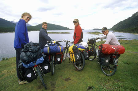 Cross country bicyclists in Andes Mountains, Tierra del Fuego National Park, Ushuaia, Argentina