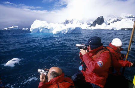 Ecological tourists from cruise ship Marco Polo in inflatable Zodiac boat in Errera Channel at Culverville Island, Antarcticaのeditorial素材