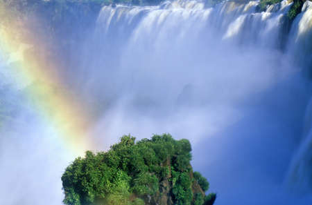Rainbow over Iguazu Waterfalls in Parque Nacional Iguazu viewed from Upper Circuit, border of Brazil and Argentinaのeditorial素材