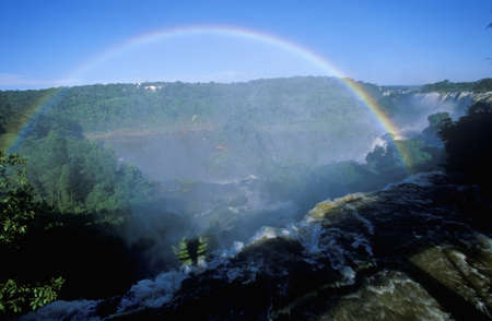 Complete arch rainbow over Iguazu Waterfalls in Parque Nacional Iguazu, border of Brazil and Argentinaのeditorial素材