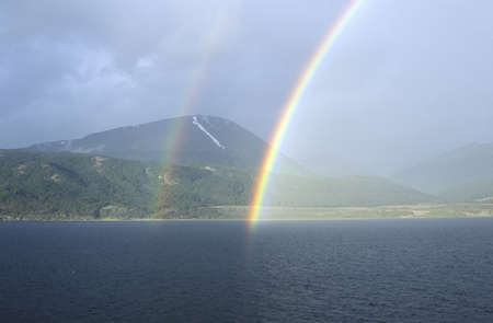 Double rainbow over ocean at Ushuaia, Tierra del Fuego National Park and Andes Mountains, Argentinaのeditorial素材