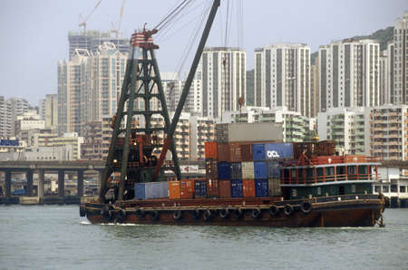 Freighter ships and Hong Kong cityscape