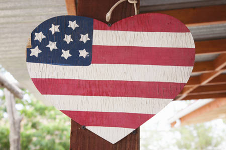 A heart in the shape of an American flag suggests love of Americaの写真素材