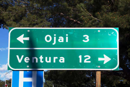Street sign pointing to Ventura and Ojai, California, USA