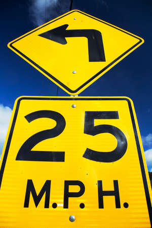 Yellow street sign saying 25 Miles Per Houseの写真素材